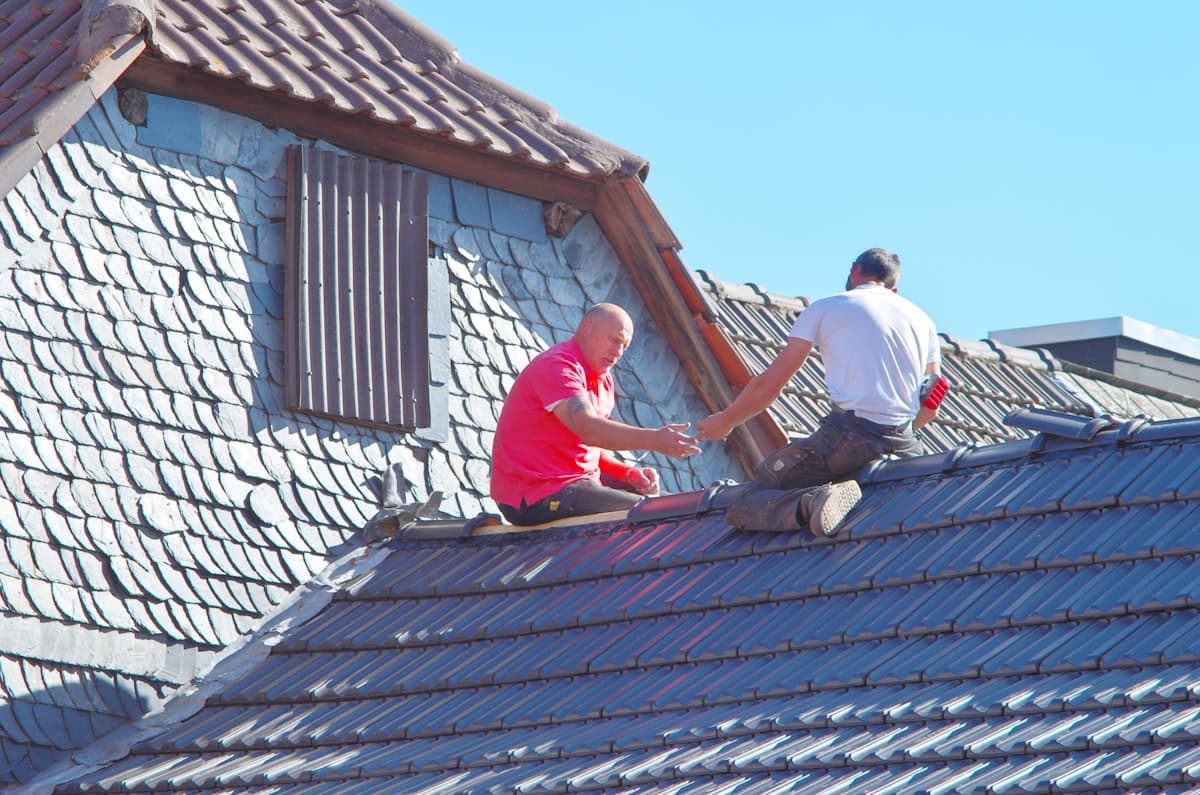 Founding crew placeholder — two roofers on a roof, Southwest region